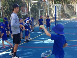 Studnet learning to hit in tennis